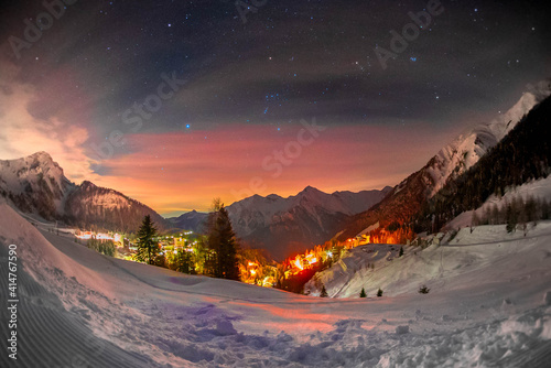 winter night in the alps with snow and stars