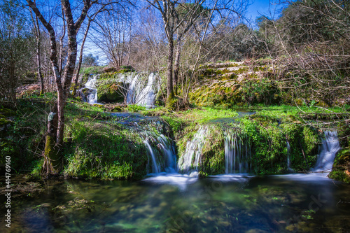 River waterfall with silky water in the little village of Beselga, Portugal