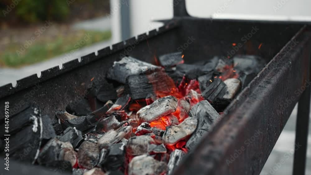 Burning coal in iron brazier. Preparation for barbecue. Burning coal in iron brazier. Preparation for barbecue.