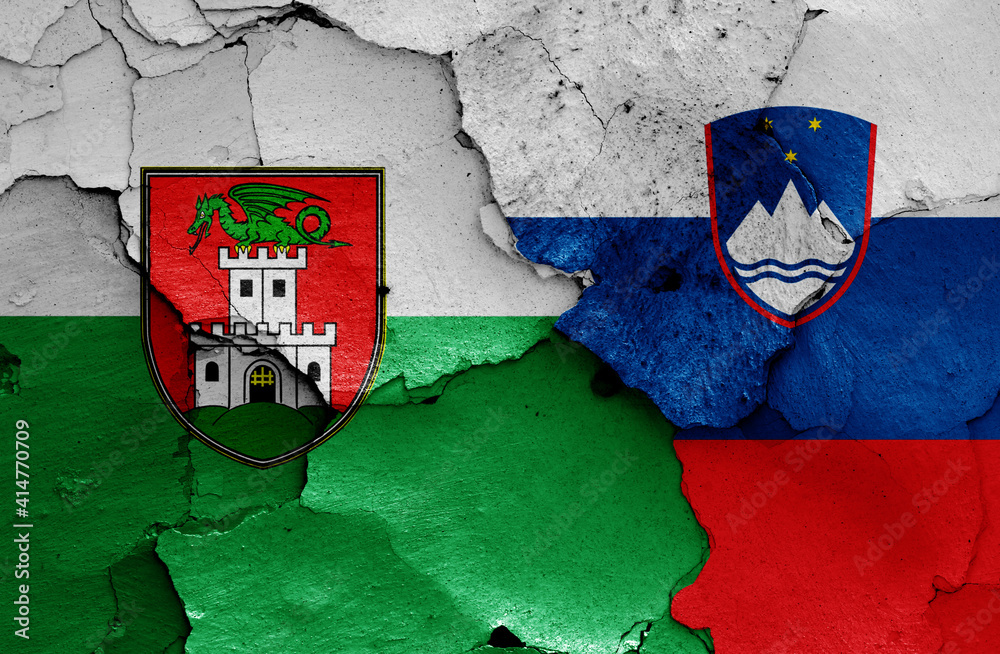 flags of Ljubljana and Slovenia painted on cracked wall