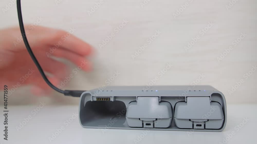 Drone batteries charging in charging hub. Drone batteries charging in charging hub.