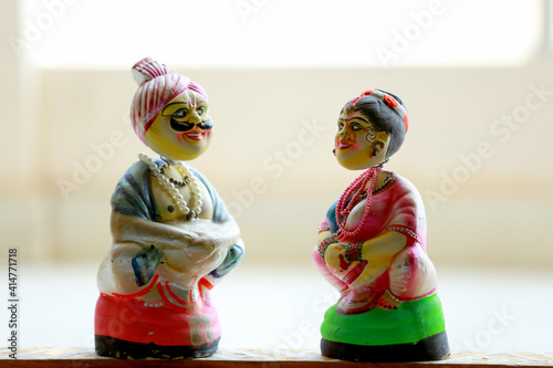 Obraz na plátne Closeup shot of traditional Indian dolls on a blurred background