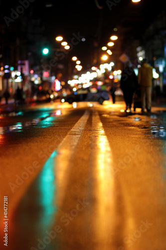 Night city wet track and lantern lights