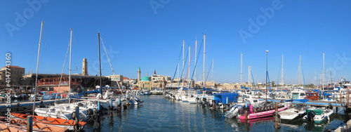 Acre, Israel - February 14, 2021. Beautiful panoramic views of the yachts at the pier and ancient architecture in the old city of Acre. Buildings of Muslim and Christian religions in one place.  © Olha Petrash
