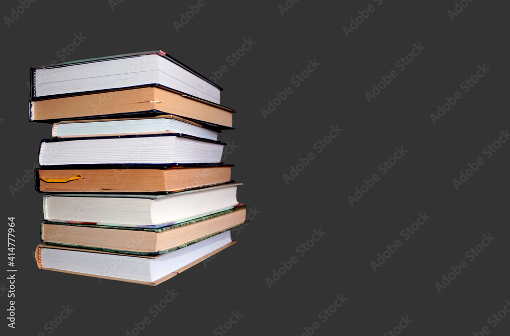 stack of books isolated on black background, dark gray backdrop stack of books isolated on black background, dark gray backdrop