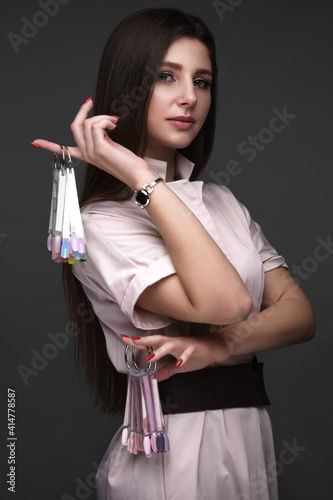 Manicurist in working form with tools in hand. Nail photo content photo