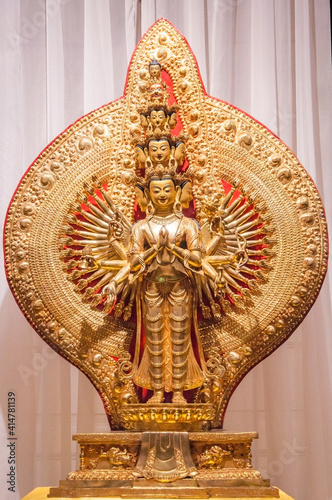 The form of a thousand armed Avalokitesvara with eleven persons (Mahakarunika, Great Compassion)  photo
