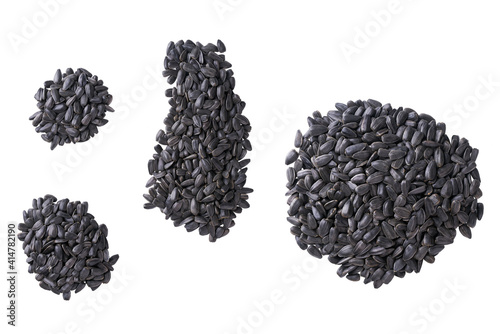 Pile of black sunflowers seeds isolated on a white background. Top view.
