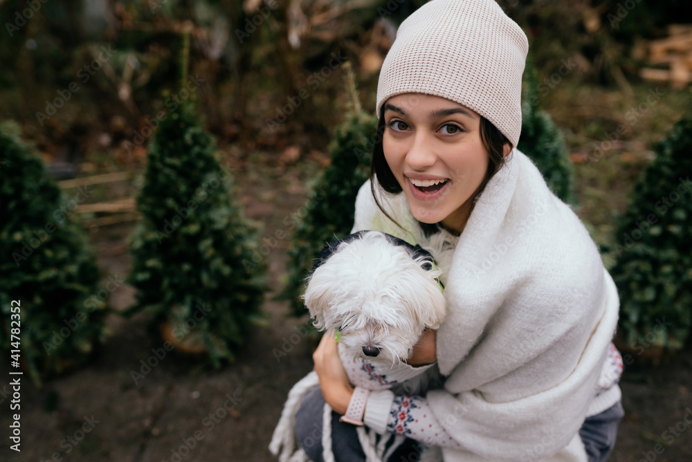 Beautiful young woman with a white dog Beautiful young woman with a white dog