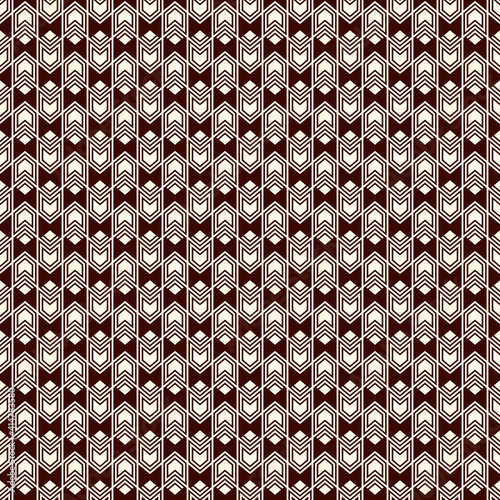 Seamless pattern with arrow fletching. Repeated chevrons wallpaper. Tribal and ethnic motif. Native americans ornament