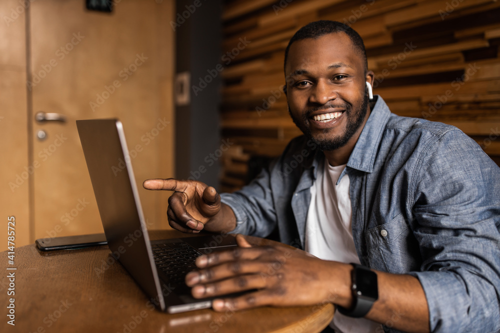 Headshot portrait smiling african american business man making video call, looking at camera, confident positive young trainer leading a remote lesson, businessman participating in online conference. Headshot portrait smiling african american business man making video call, looking at camera, confident positive young trainer leading a remote lesson, businessman participating in online conference.