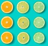 Citrus Fruit pattern on blue background. Orange, Lime, Lemon slices background. Flat lay, top view. .  Pop art design, creative summer concept.