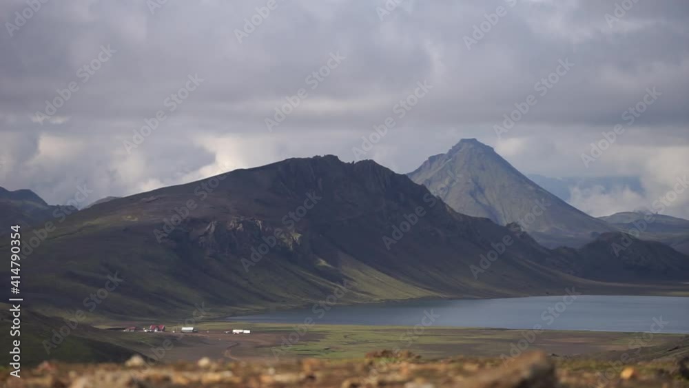 View on Hvanngil mountain hut and camp site with green hills, river stream and lake. Laugavegur hiking trail, Iceland View on Hvanngil mountain hut and camp site with green hills, river stream and lake. Laugavegur hiking trail, Iceland