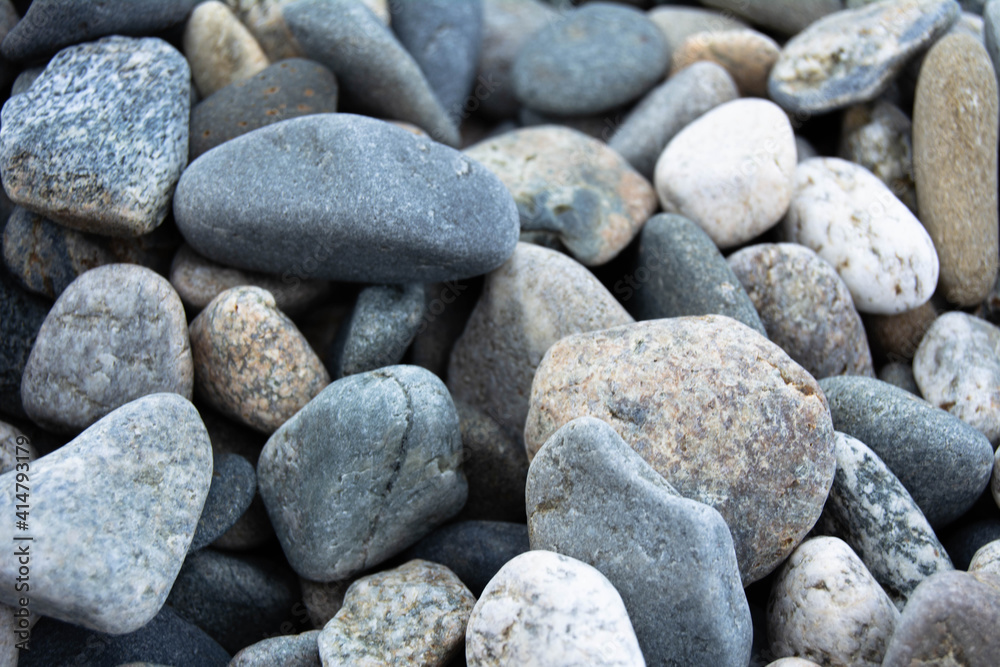 Multicolored pebble stones on the beach close-up. Horizontal photo Multicolored pebble stones on the beach close-up. Horizontal photo