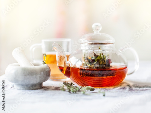 homemade herbal tea in a glass teapot