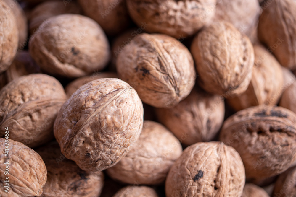 walnuts in shell, walnut hock, cracked walnuts, close-up. walnuts in shell, walnut hock, cracked walnuts, close-up.