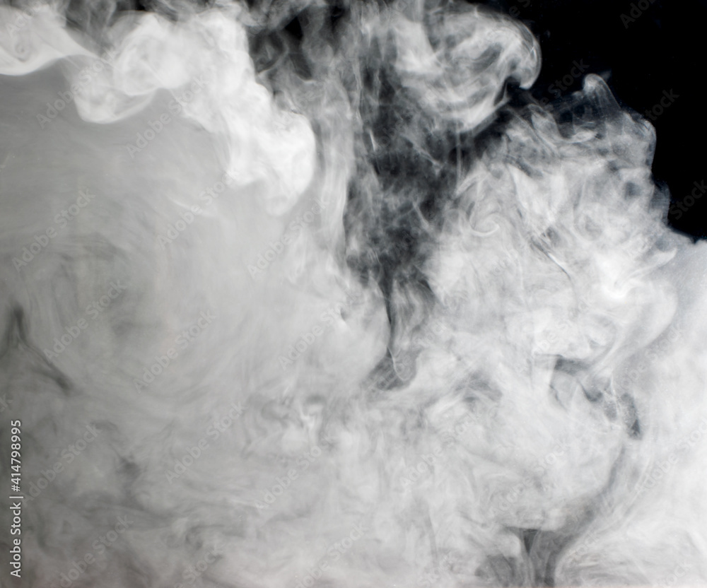 Abstract background of chaotically mixing clouds of white smoke against a background of darkness Abstract background of chaotically mixing clouds of white smoke against a background of darkness