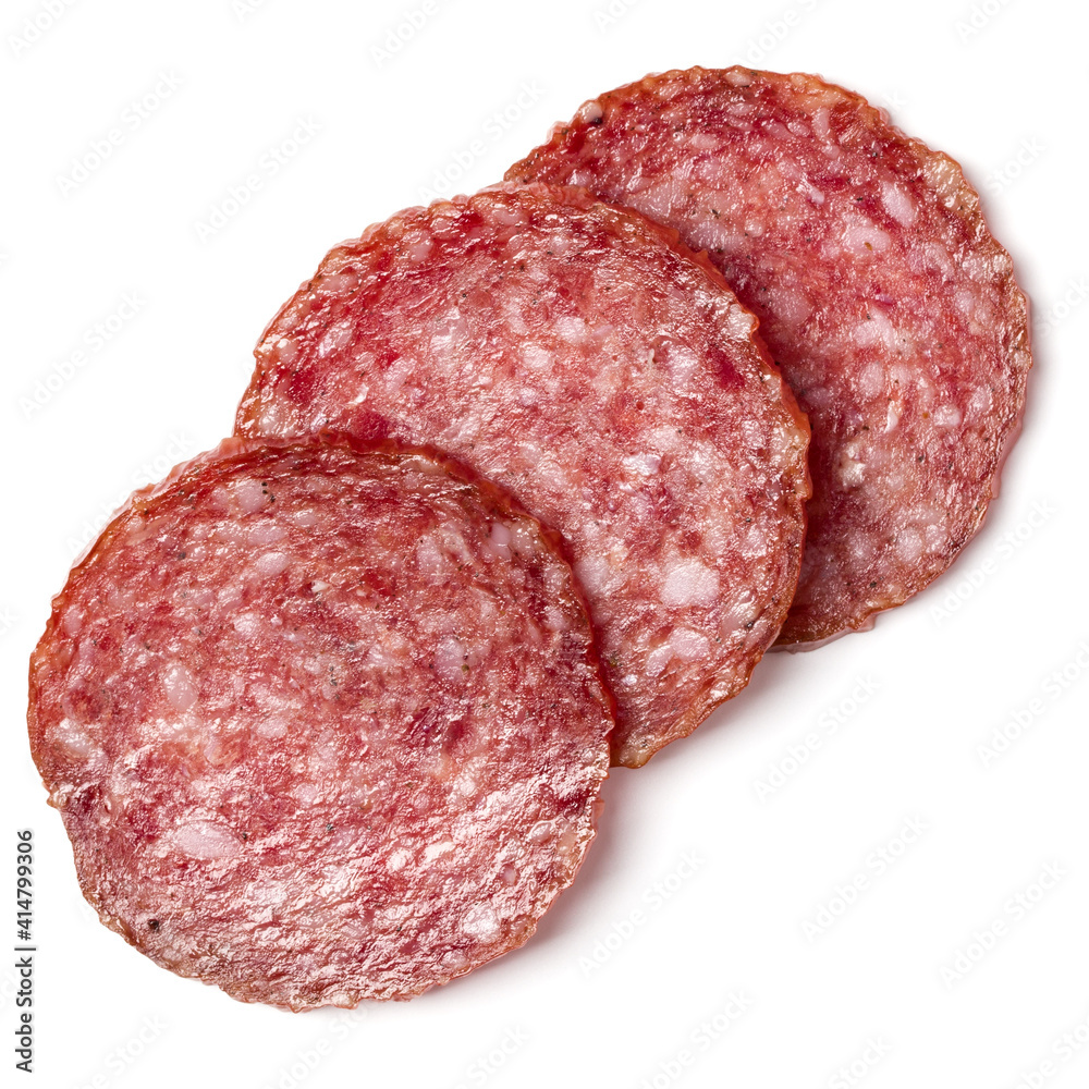 Slices of salami isolated on white background closeup. Sausage top view. Slices of salami isolated on white background closeup. Sausage top view.