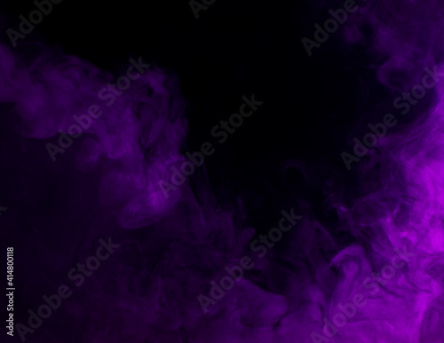 Abstract background of chaotically mixing puffs of purple smoke on a dark background