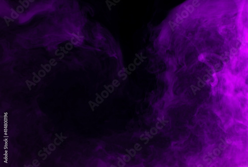 Abstract background of chaotically mixing puffs of purple smoke on a dark background