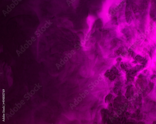 Wallpaper Mural Abstract background of chaotically mixing puffs of purple smoke on a dark background Torontodigital.ca