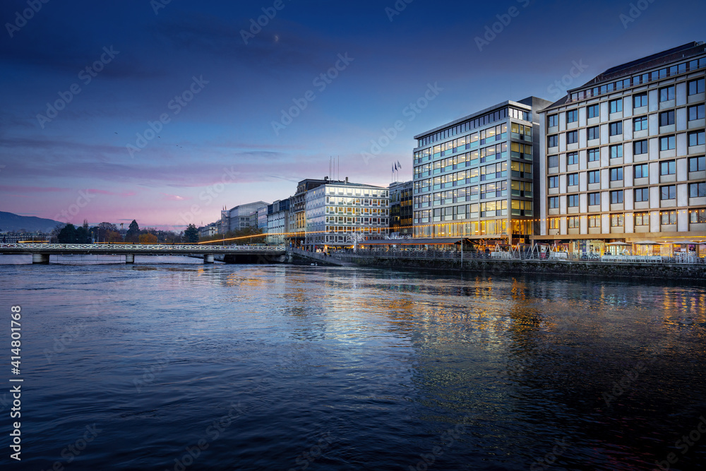 Rhone River and Geneva skyline at night - Geneva, Switzerland Rhone River and Geneva skyline at night - Geneva, Switzerland