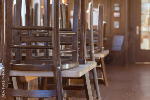 Covid 19 and closed restaurant with chairs on tables because of lockdown or shutdown in corona times in germany