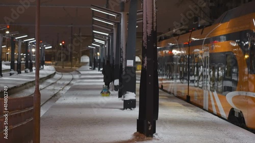 Wallpaper Mural A cold night in the train station in the city with the train on the side Torontodigital.ca