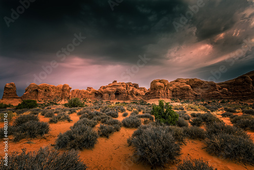 Dramatic clouds over the window section in the Arches National Park, Utah photo