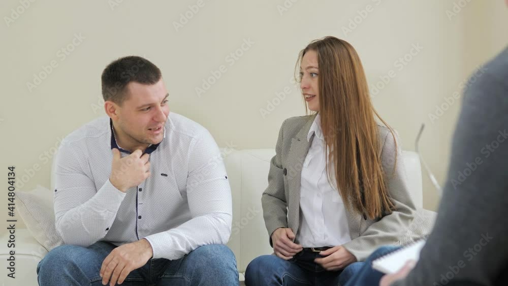 Unhappy couple talking to a psychologist before breaking up at a therapy session, consulting family relationships expert Unhappy couple talking to a psychologist before breaking up at a therapy session, consulting family relationships expert
