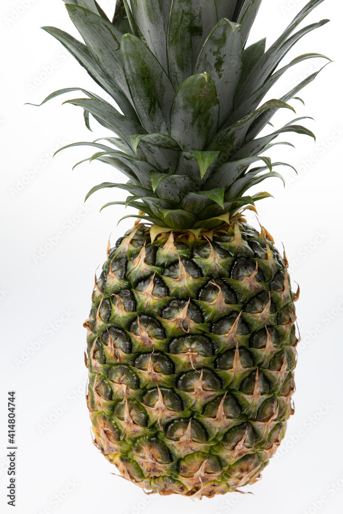 Fototapeta premium Fresh green pineapple isolated on white background