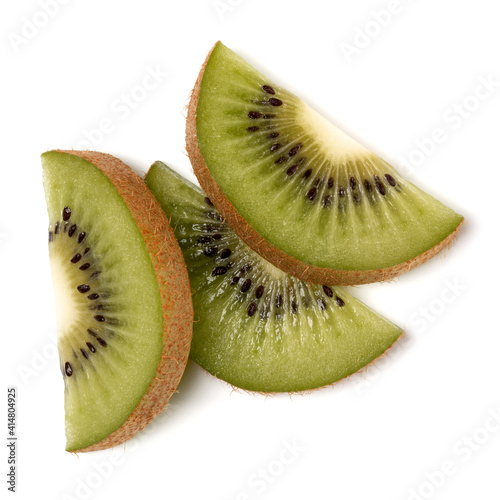 Three kiwi fruit slices isolated on white background closeup. Half of kiwi slice. Kiwifruit slice,  flatlay. Flat lay, top view.