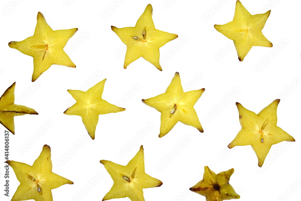 Star shaped slices of carambola fruit isolated on white background. Carambola fruit with slice of star fruit isolated on a white background. Star shaped slices of carambola fruit isolated on white background. Carambola fruit with slice of star fruit isolated on a white background.