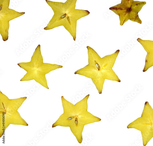 Star shaped slices of carambola fruit isolated on white background. Carambola fruit with slice of star fruit  isolated on a white background.