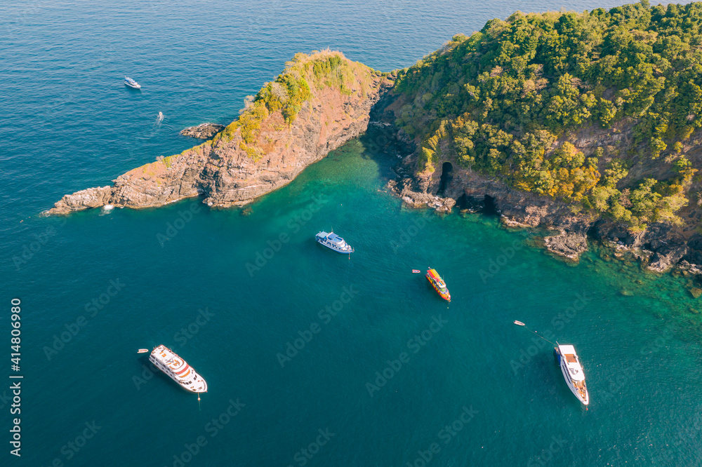 Aerial view of SCUBA diving boats moored above a coral reef at Ko Bon, Similan Islands