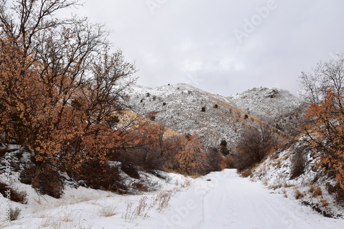 Snowy Hiking Trail views towards Lake Mountains Peak via Israel Canyon road towards Radio Towers in winter, Utah Lake, Wasatch Front Rocky Mountains, Provo, United States.