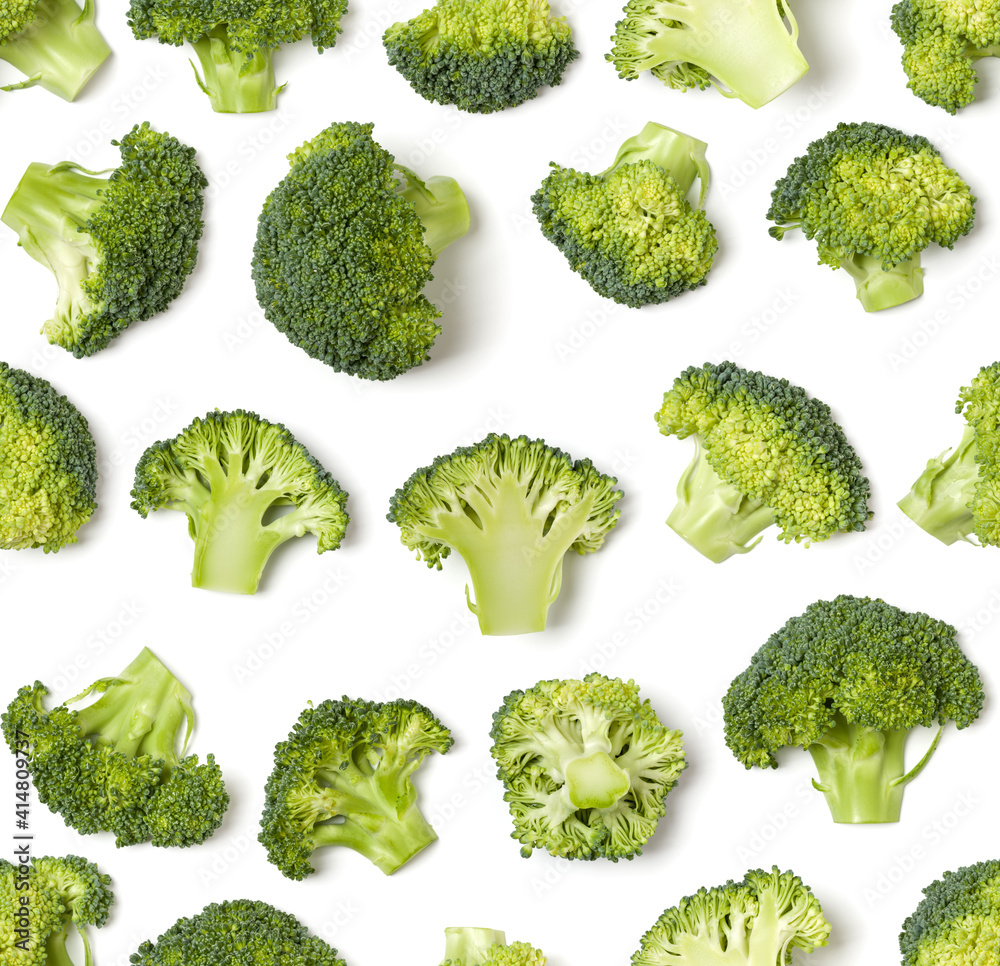 Creative layout made of broccoli. Flat lay, top view. Vegetables isolated on white background. Food ingredient seamless pattern...