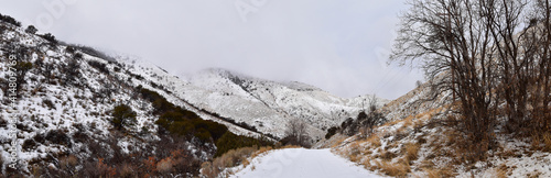 Snowy Hiking Trail views towards Lake Mountains Peak via Israel Canyon road towards Radio Towers in winter, Utah Lake, Wasatch Front Rocky Mountains, Provo, United States. © Jeremy