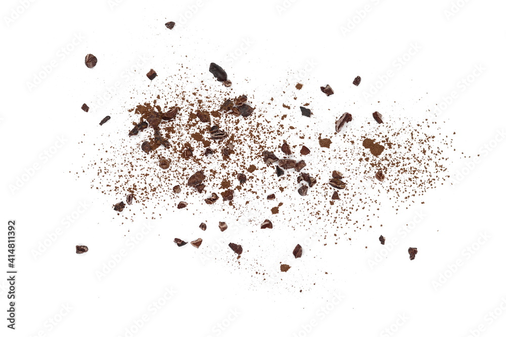 Cocoa nibsand cocoa powder isolated on white. A pieces of broken cocoa beans isolated on white background.