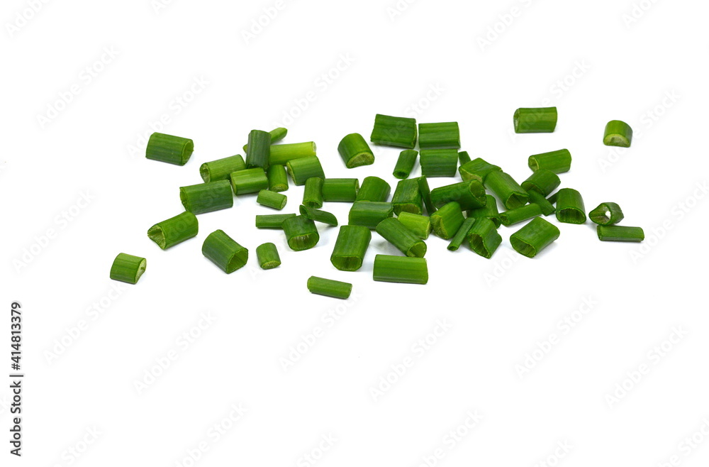 Chopped green onions isolated on white background. Fresh green onion feathers close-up. Chopped chive Chopped green onions isolated on white background. Fresh green onion feathers close-up. Chopped chive
