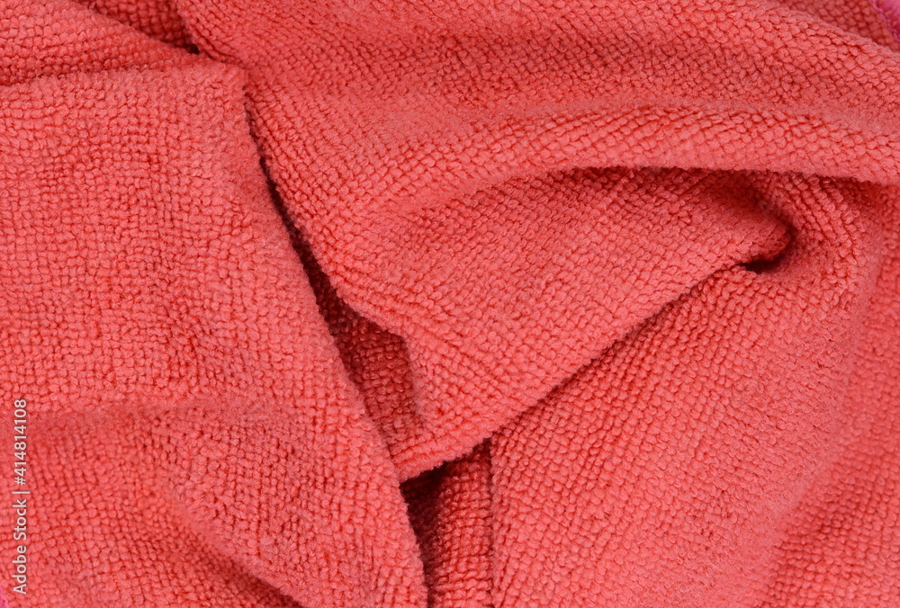 Red micro fiber towel isolated on white background. Clean, new red microfiber cloth isolated on white background