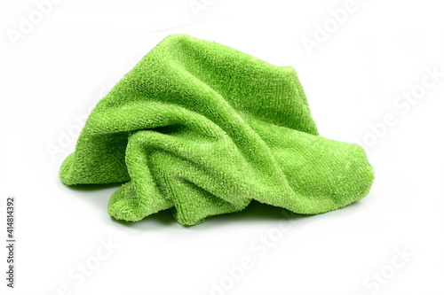 Green micro fiber towel isolated on white background. Clean, new green microfiber cloth isolated on white background
