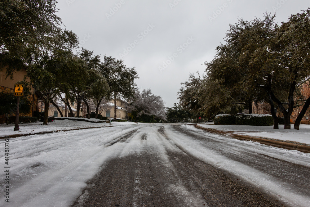 Ice and Snow Partially Melted on Paved Roadway in Winter Ice and Snow Partially Melted on Paved Roadway in Winter