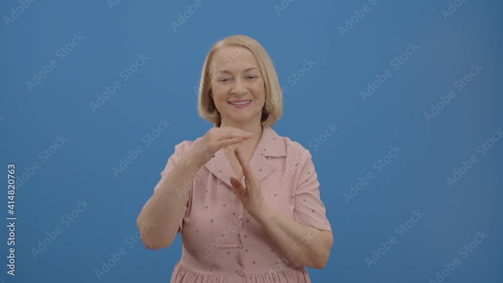 Portrait of woman asking time to relax after hard workout, showing hand sign.