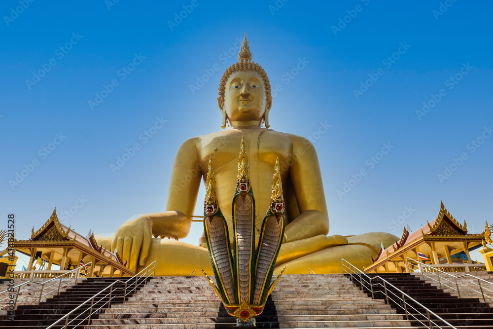 big golden Buddha statues with  serpent at front in ang thong Thailand .