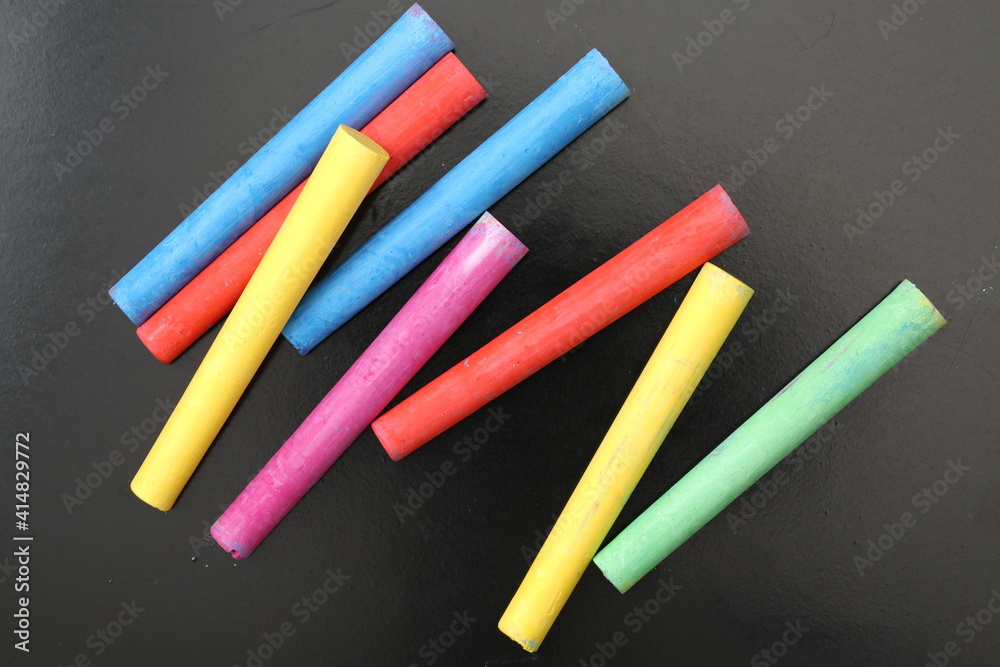 chalks in a variety of colors arranged on a white background chalks in a variety of colors arranged on a white background