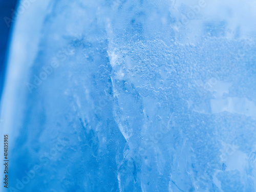 Different Ice texture close up. Macro shot. Soft focus. Blue background.