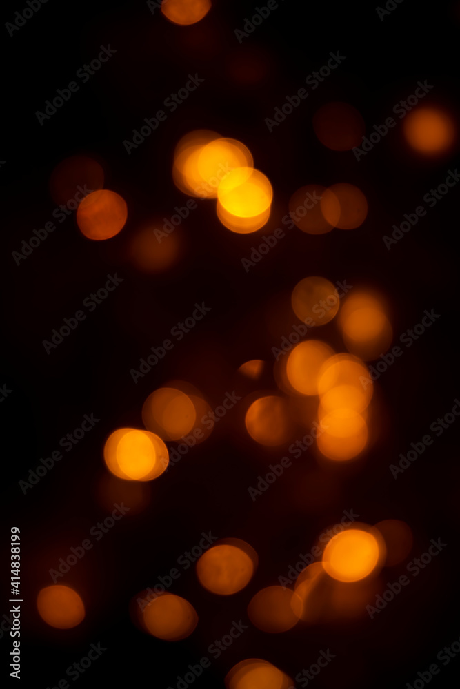 Obraz premium Abstract dark orange dots black background for texture 
