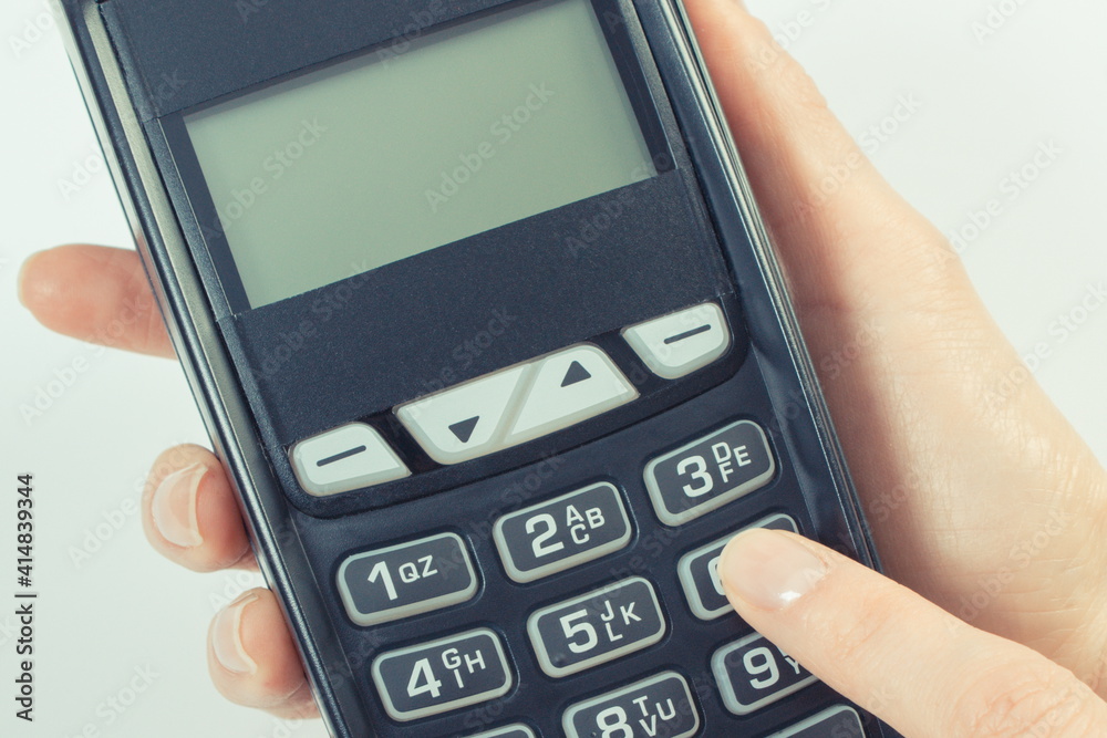 Hand using payment terminal. Enter personal identification number. Cashless paying for different things. Hand using payment terminal. Enter personal identification number. Cashless paying for different things.