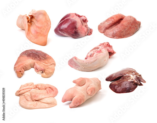 assorted raw pork meat on white background